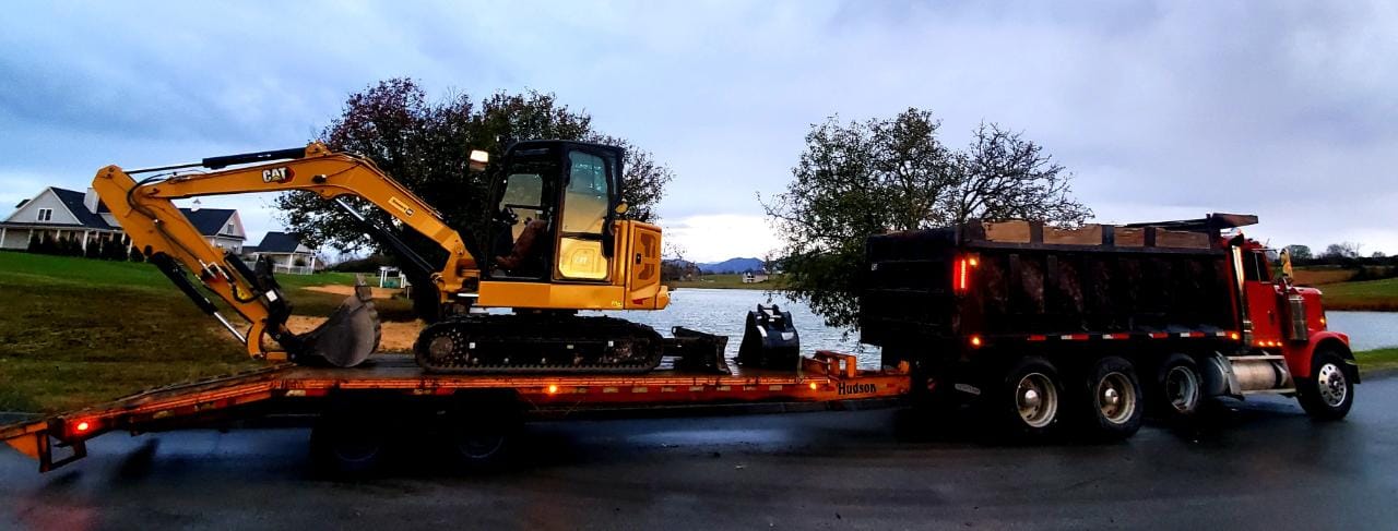 Excavator loaded up at the end of the work day and headed home